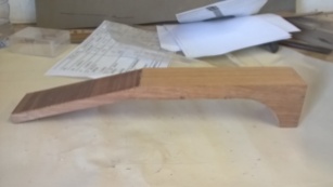 Stage 3: Using a band saw cut the neck into its rough shape. Hand filing and sanding will later refine the shape.
